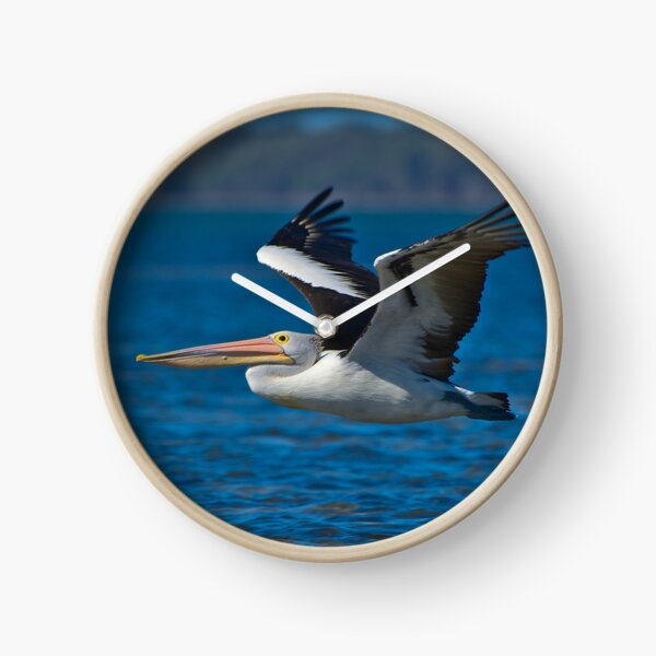 Item preview, Pelicans A White Pelican Bird Flying Low Over The Blue Water - Portrait designed and sold by Jason Gilbert.