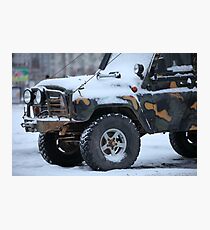 SUV in snow Photographic Print