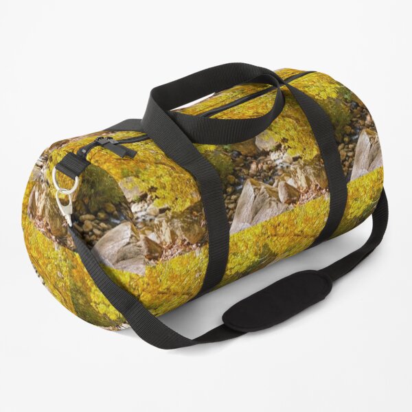 AUTUMN TREE LEANING OVER THE RIVER Duffle Bag
