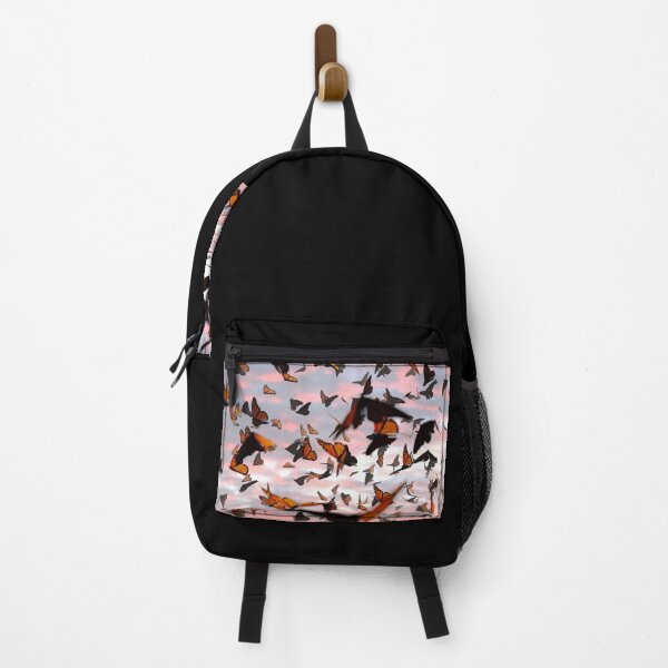 Item preview, swarm of monarch butterflies, Danaus plexippus group during sunset designed and sold by DottedYeti.