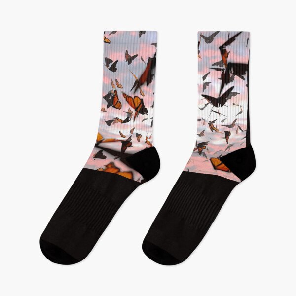 Item preview, swarm of monarch butterflies, Danaus plexippus group during sunset designed and sold by DottedYeti.