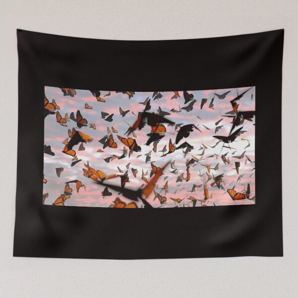 Item preview, swarm of monarch butterflies, Danaus plexippus group during sunset designed and sold by DottedYeti.