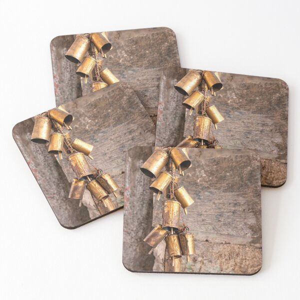 Item preview, A bunch of copper bells on a multi-colored thread close-up on a stone wall background designed and sold by EG Creativity Art.