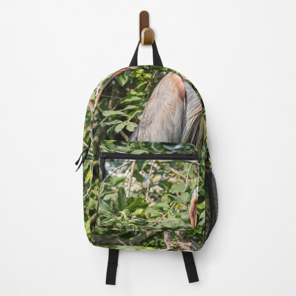 Item preview, Purple heron resting on a branch in the green foliage of a tree designed and sold by brambillasimone.