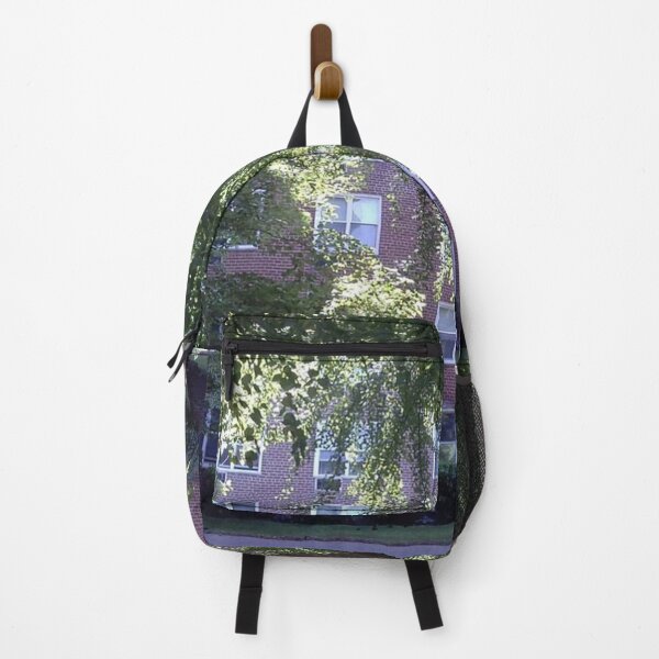 Leaves of trees pierced by a sunbeam Backpack