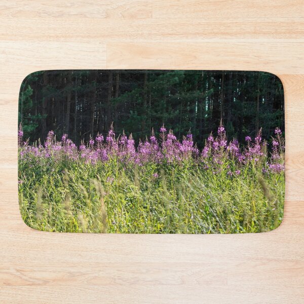 Item preview, Sunlit Chamaenerion angustifolium flowers against dark shadowed forest designed and sold by lena-maximova.