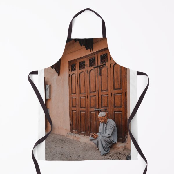Item preview, man setting next to his shop in marrakech souk market medina designed and sold by Morocco Marrakech Photo Prints.