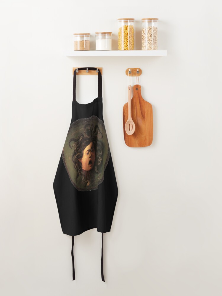Alternate view of Medusa. Gorgon. Venomous snakes in place of hair. Monster. Greek Mythology. Michelangelo, Caravaggio. on BLACK. Apron