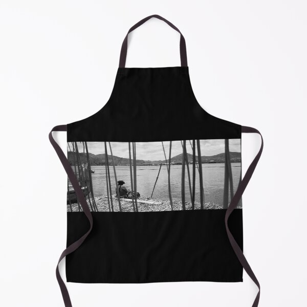 Item preview, Indio Sitting By The Lake On Floating Reed - Titicaca Lake, Peru designed and sold by LucaRocchini.
