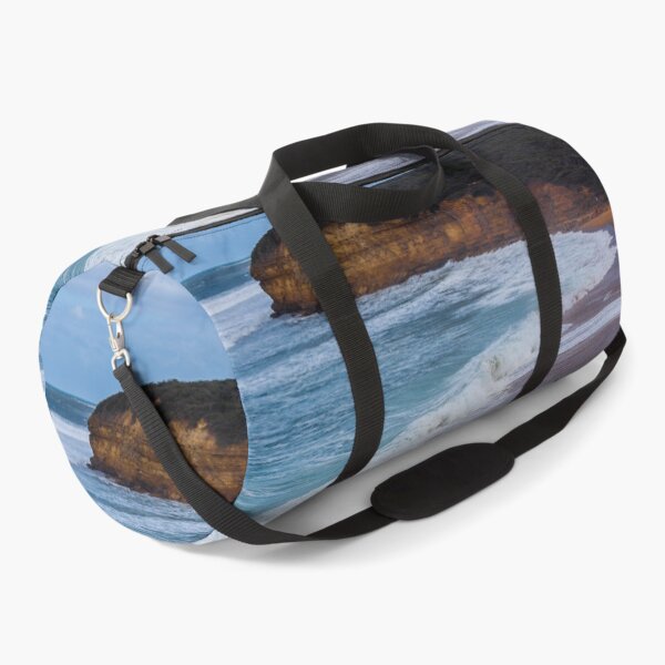 Item preview, A surfer runs away from the pro-waves at Bells Beach, Australia. designed and sold by shaynetwright.