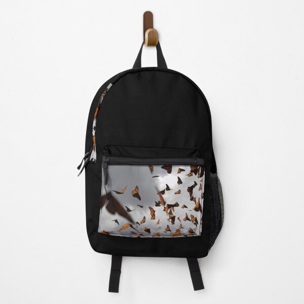Item preview, group of monarch butterflies, Danaus plexippus swarm in front of dark clouds designed and sold by DottedYeti.