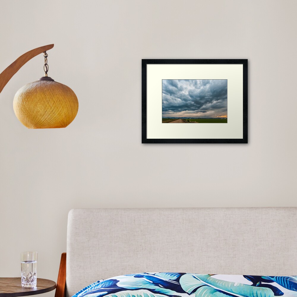 Storm Clouds on The Road Home Framed Art Print