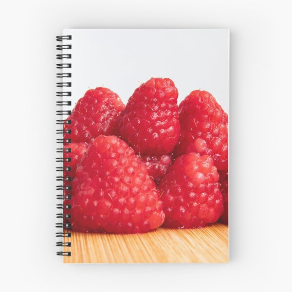 Item preview, Fresh red raspberry fruits stacked on wooden board designed and sold by krisgreenwood.