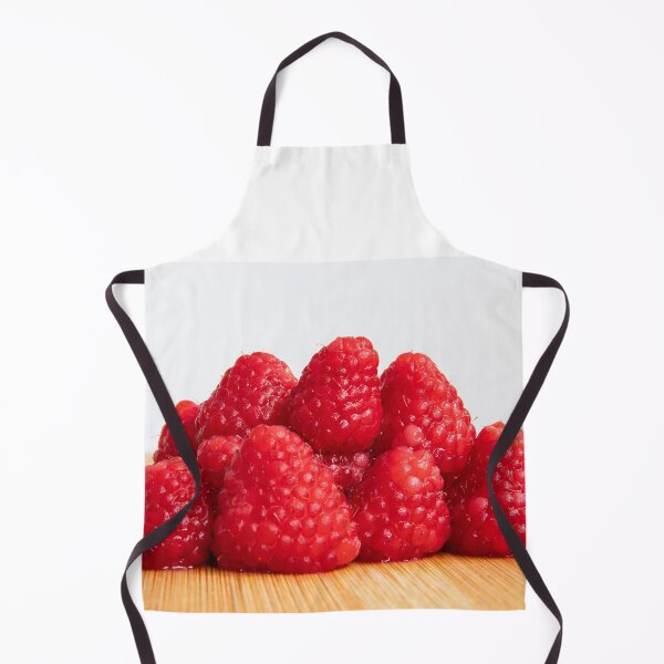 Item preview, Fresh red raspberry fruits stacked on wooden board designed and sold by krisgreenwood.