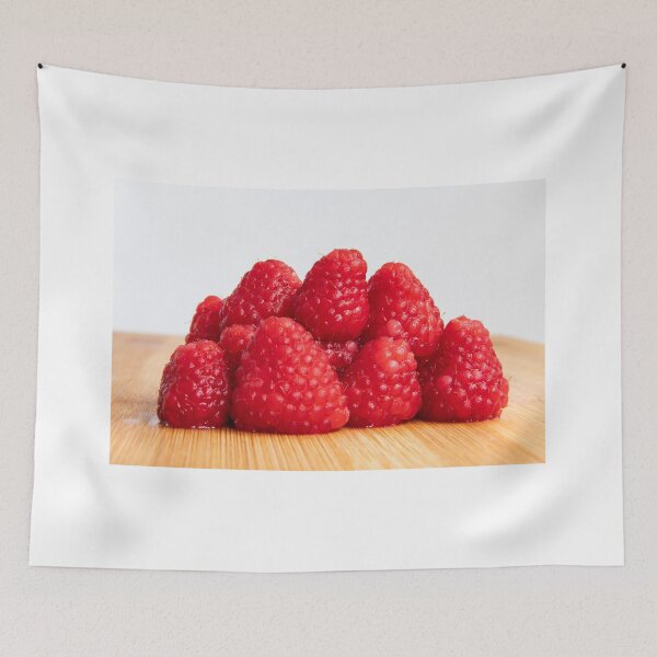 Item preview, Fresh red raspberry fruits stacked on wooden board designed and sold by krisgreenwood.
