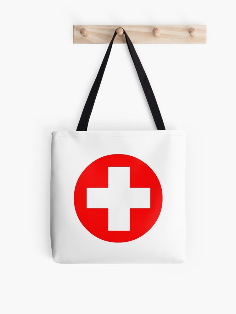 luggage with red cross symbol