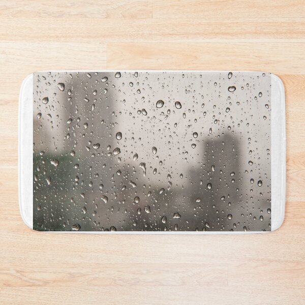 Item preview, Close up of drops of rain water running down clear glass window designed and sold by krisgreenwood.