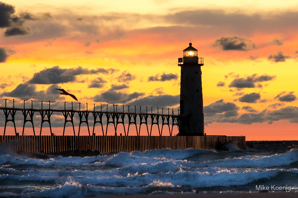 "Manistee Michigan Lighthouse at Sunset" by Mike Koenig Redbubble