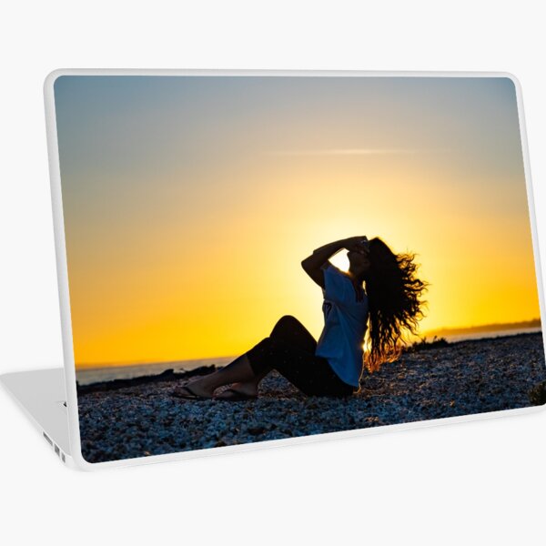 Enjoying the sunset Laptop Skin