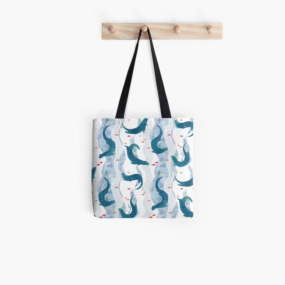 Swimming otters in blue Tote Bag