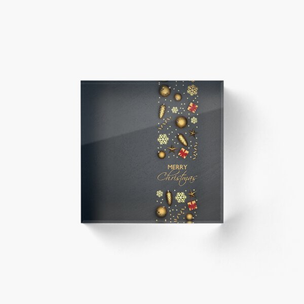 A band of flat lay golden christmas ornaments on a black stone plate. Text "Merry Christmas" inbetween. Acrylic Block