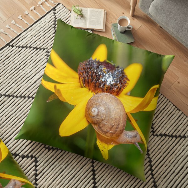 Snail eating a flower Floor Pillow
