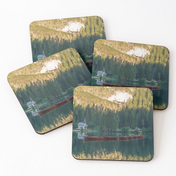 Item preview, Row of wooden boats in front of a church reflected in the water designed and sold by brambillasimone.