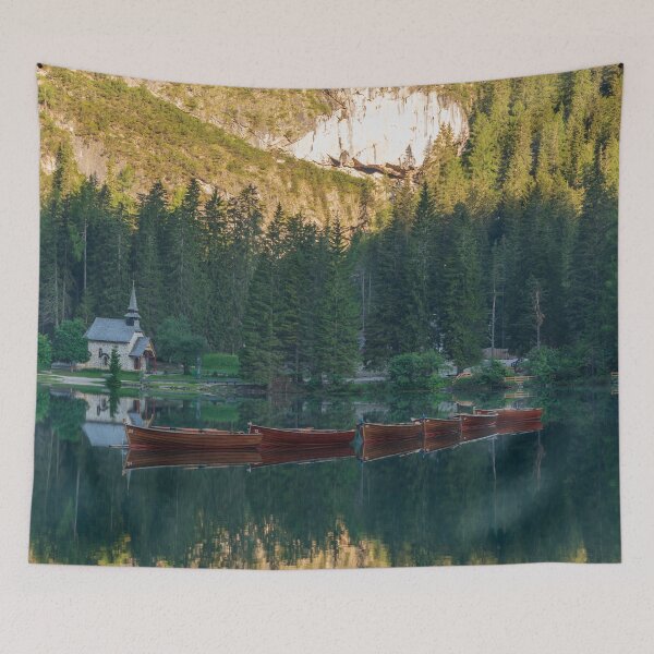 Item preview, Row of wooden boats in front of a church reflected in the water designed and sold by brambillasimone.