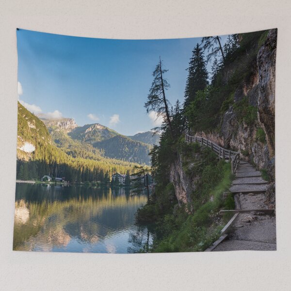 Item preview, A path with a wooden fence climbs steeply beside the Braies lake designed and sold by brambillasimone.