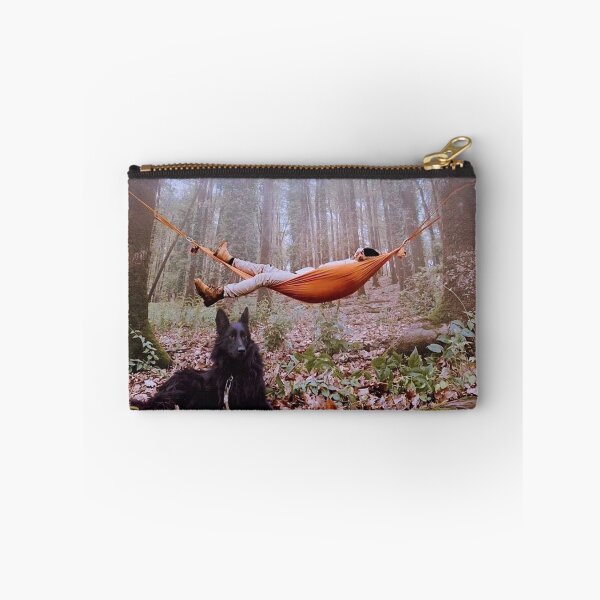 Item preview, young man relaxing with his dog in a rain forest designed and sold by slambob.
