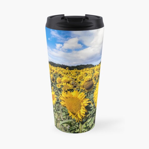 Field Of Sunflowers With A Blue Sky And Clouds Travel Mug