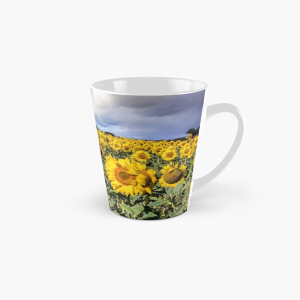 Field Of Sunflowers With A Blue Sky And Clouds Tall Mug