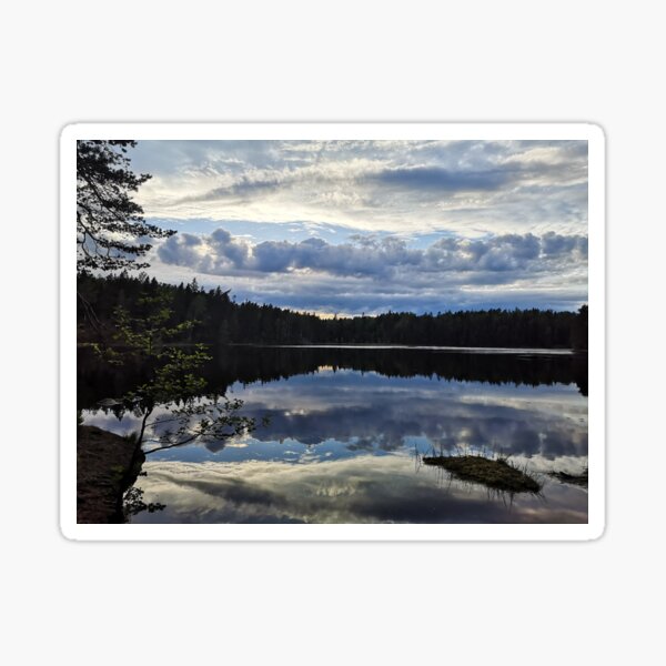 Reflections on a lake Sticker