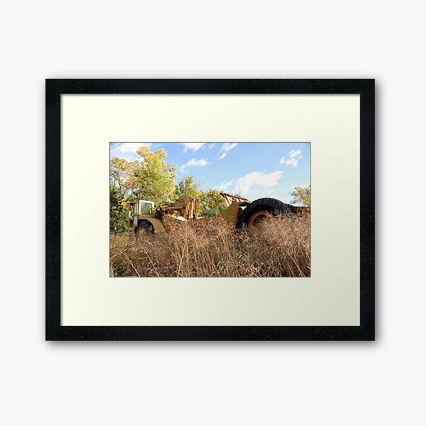 Land Grader parked in the grass Framed Art Print