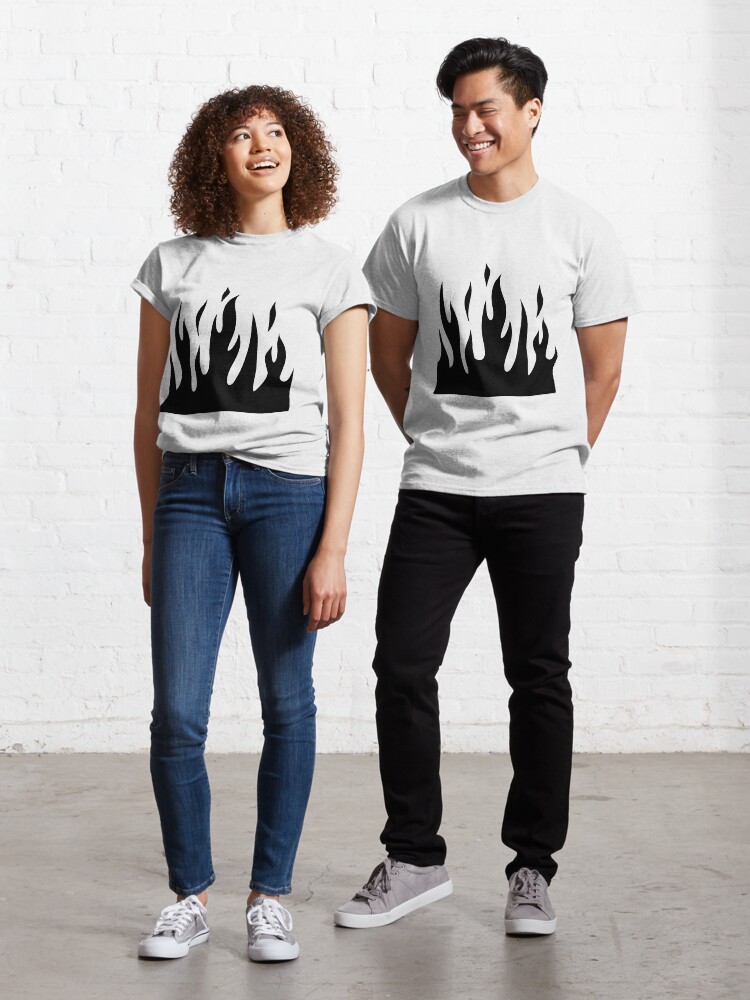 jeans with black flames on the bottom