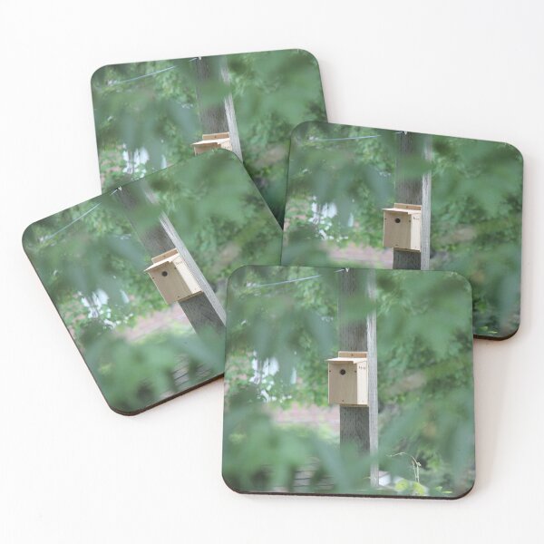 Item preview, Wooden bird house seen through trees designed and sold by stina-bee.