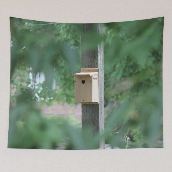 Item preview, Wooden bird house seen through trees designed and sold by stina-bee.