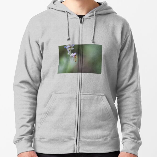 Hoverfly collects pollen from a lilac flower Zipped Hoodie