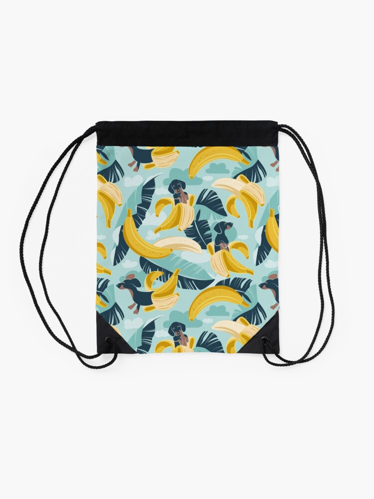 Alternate view of Surrealistic tropical Dachshund bananas // aqua background navy blue dogs and banana fruit leaves Drawstring Bag