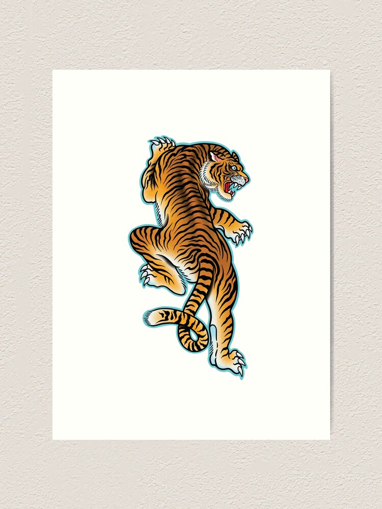 Tiny minimalistic tiger portrait tattoo located on the