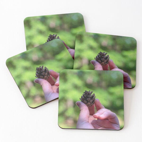Item preview, Hand holding pine cone designed and sold by lena-maximova.