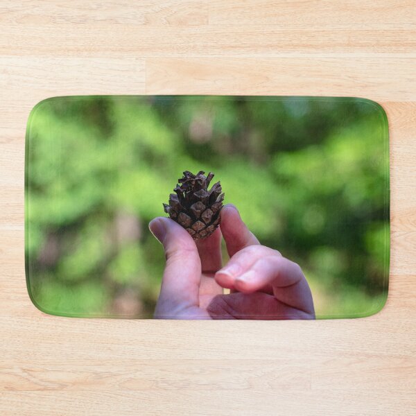 Item preview, Hand holding pine cone designed and sold by lena-maximova.
