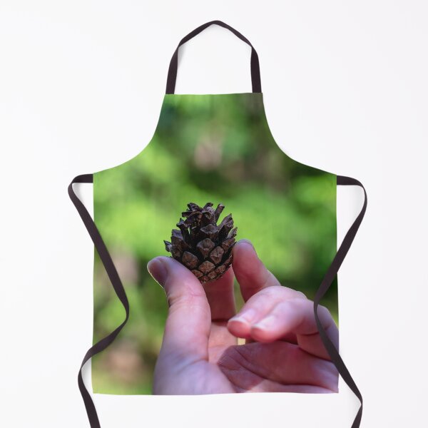 Item preview, Hand holding pine cone designed and sold by lena-maximova.