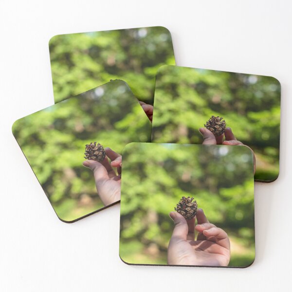Item preview, Hand holding pine cone designed and sold by lena-maximova.