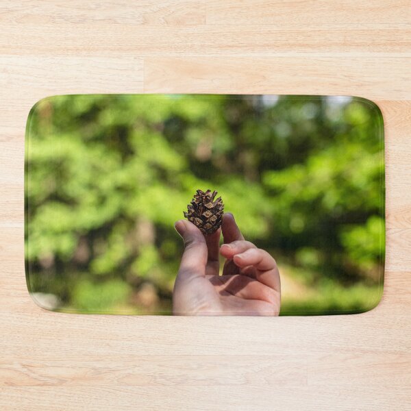Item preview, Hand holding pine cone designed and sold by lena-maximova.