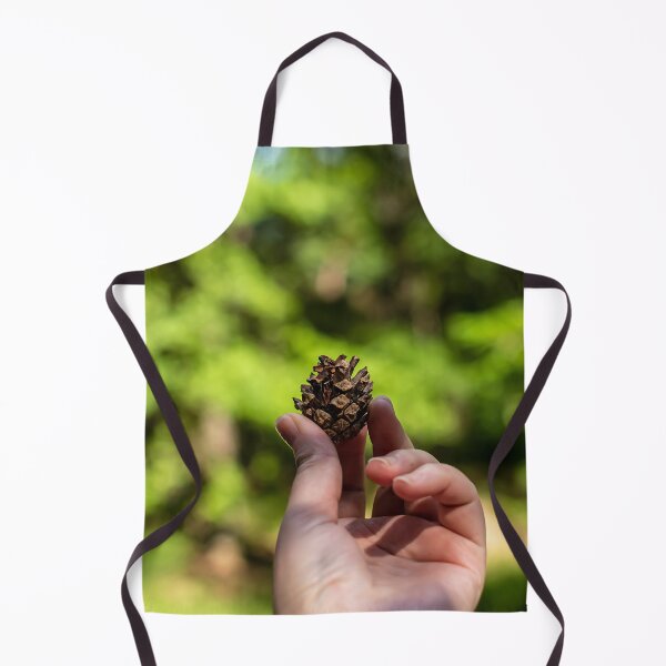 Item preview, Hand holding pine cone designed and sold by lena-maximova.