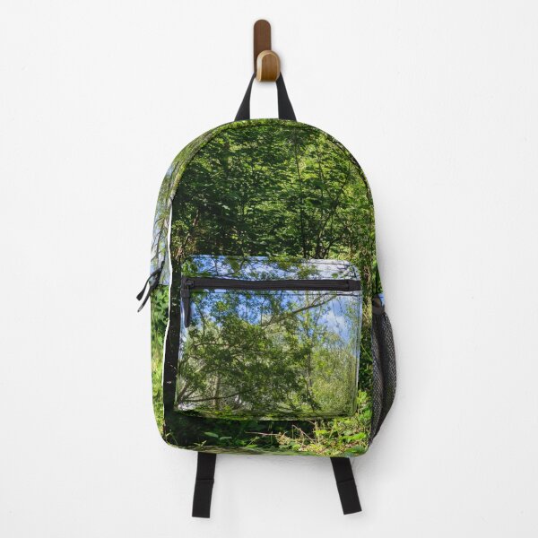 clouds seen through the trees in weelsby woods Backpack