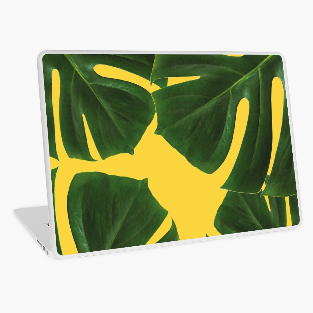Graphic green palm leaves, yellow background Laptop Skin