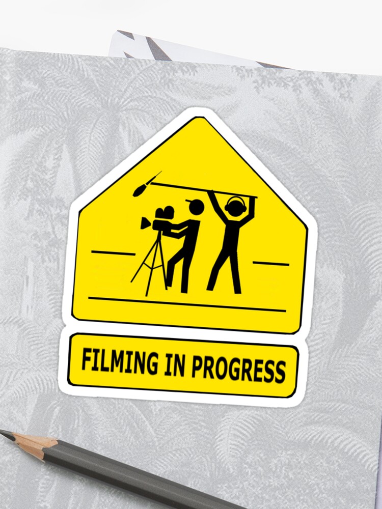 Filming in progress sign
