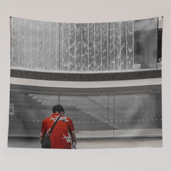 Item preview, A man in a red shirt sits in front of a fountain designed and sold by brambillasimone.